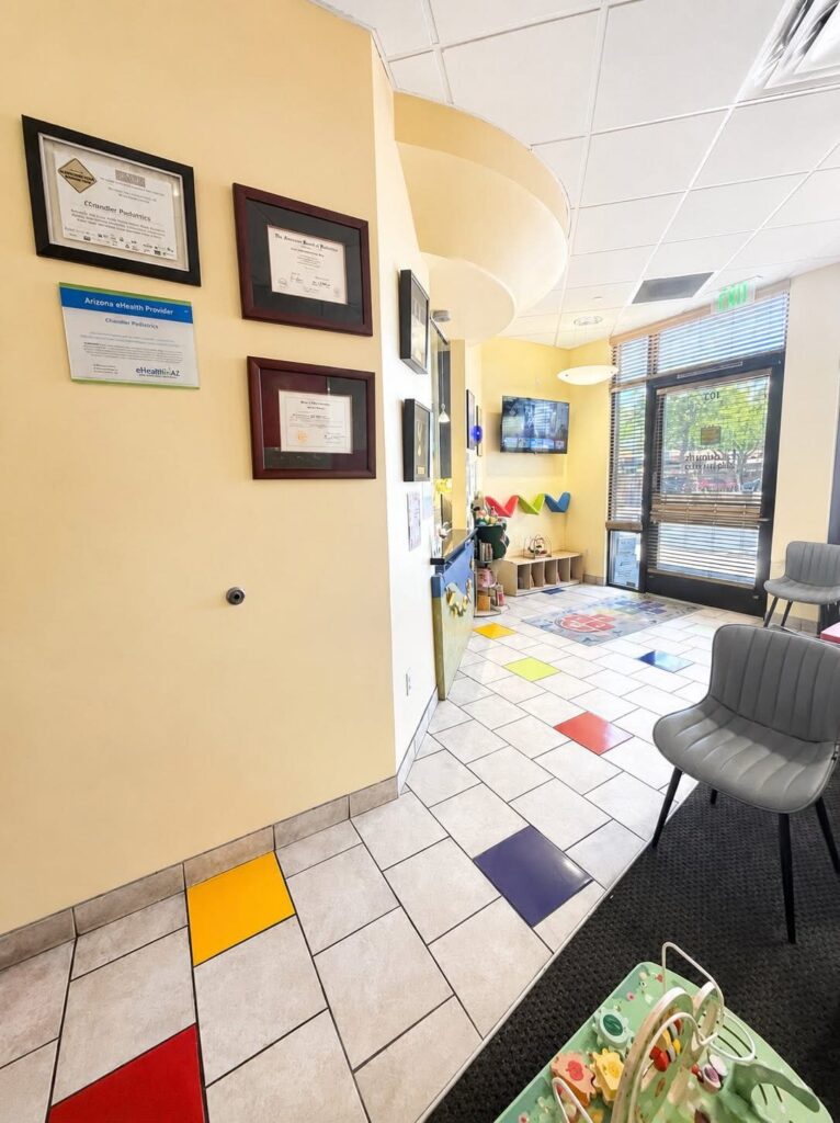 The lobby, with framed certificates and a play corner