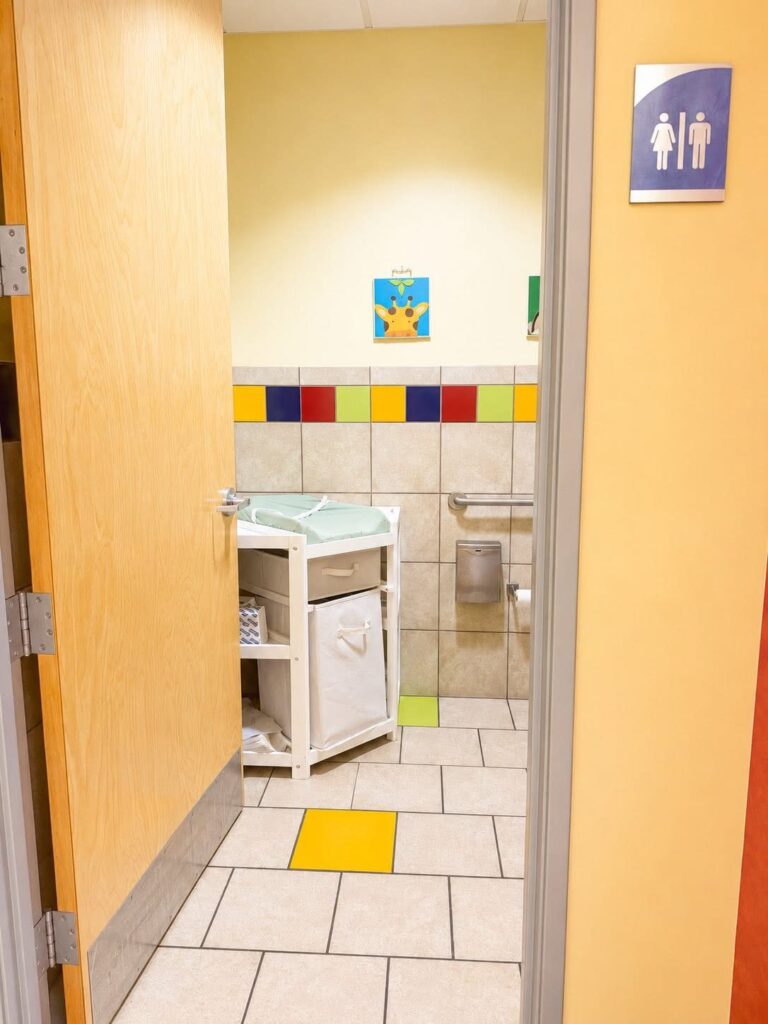 The restroom, with a baby changing table